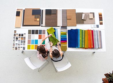 Arial view of people at desk designing products